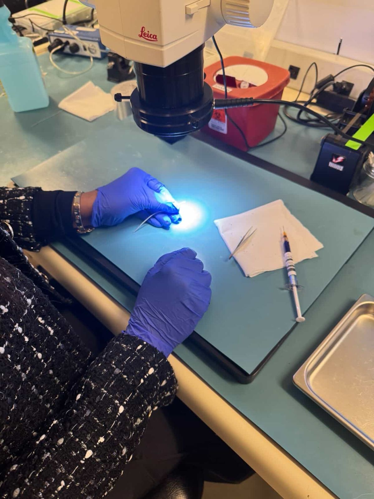 Micro-fine gold wiring hand-laid under the microscope at Advanced Bionics